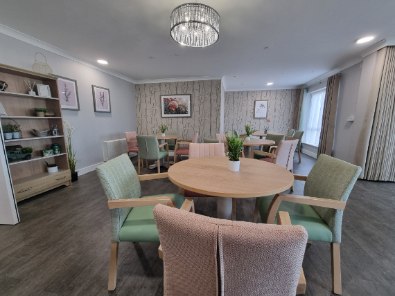 care home dining room with pastel fabric chairs