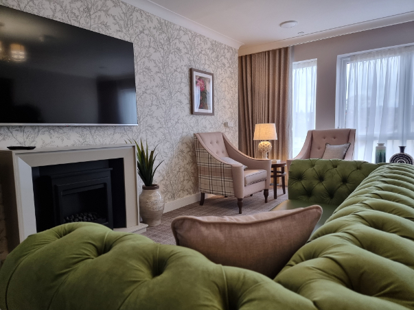 sofas and television in care home lounge